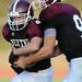 Dexter senior Michael Mioduszewski fakes a hand off to senior Jacob Stegemann during the first quarter against Skyline at Dexter on Friday night.